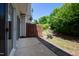 Back patio with a sliding glass door and wooden privacy fence at 5209 Echo Ridge Rd, Raleigh, NC 27612