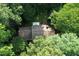 Aerial view of the home surrounded by mature trees showcases its private and serene setting at 5304 Cypress Ln, Raleigh, NC 27609
