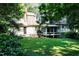 Manicured backyard with a sunroom and a well-maintained lawn provides a peaceful outdoor space at 5304 Cypress Ln, Raleigh, NC 27609