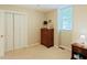 Bedroom featuring hardwood floors, closet and windows offering tons of natural light at 5304 Cypress Ln, Raleigh, NC 27609