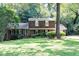 Charming two-story brick home with a well-manicured lawn and lush landscaping at 5304 Cypress Ln, Raleigh, NC 27609