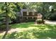 Charming brick home with mature landscaping and a well-manicured lawn offers great curb appeal at 5304 Cypress Ln, Raleigh, NC 27609