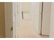 Hallway with neutral walls and carpet leading to the upper level of the home at 5304 Cypress Ln, Raleigh, NC 27609