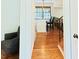 View of the kitchen with an island, wood floors, white cabinets and countertops at 5304 Cypress Ln, Raleigh, NC 27609
