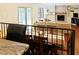 Open concept living room with a dining area, hardwood floors, and a cozy fireplace at 5304 Cypress Ln, Raleigh, NC 27609