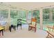 Bright sunroom with lots of windows, great natural light, and beautiful outdoor views at 5304 Cypress Ln, Raleigh, NC 27609