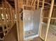 Framed bathroom with installed shower stall under construction at 5504 Jaeger Dr # 76, Graham, NC 27253