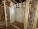 Framed bathroom showcasing white shower install with built-in shelving, awaiting finishing touches at 5504 Jaeger Dr # 76, Graham, NC 27253