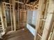 Bathroom under construction featuring a tub-shower combo with exposed wooden framing at 5504 Jaeger Dr # 76, Graham, NC 27253