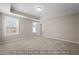 Spacious bedroom with tray ceiling, carpet, and natural light at 5504 Jaeger Dr # 76, Graham, NC 27253