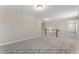 Neutral carpeted bonus room with stairs, white walls, and natural light; options may vary at 5504 Jaeger Dr # 76, Graham, NC 27253