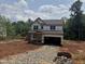 Exterior view of a home under construction with visible framing and construction materials at 5504 Jaeger Dr # 76, Graham, NC 27253