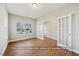 Bright room featuring wood floors, large windows and glass paned french doors at 5504 Jaeger Dr # 76, Graham, NC 27253