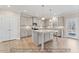 Well-lit kitchen with gray cabinets, granite countertops, a spacious island, and stainless steel appliances at 5504 Jaeger Dr # 76, Graham, NC 27253