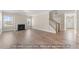 Bright living room featuring a fireplace, wood floors, and abundant natural light at 5504 Jaeger Dr # 76, Graham, NC 27253