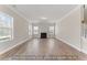 Bright living room featuring a fireplace, wood floors, and abundant natural light at 5504 Jaeger Dr # 76, Graham, NC 27253