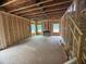 Framed living room with windows, fireplace, and staircase under construction at 5504 Jaeger Dr # 76, Graham, NC 27253