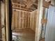 Unfinished room featuring exposed wood frame construction, insulation, and wooden subfloor at 5504 Jaeger Dr # 76, Graham, NC 27253