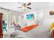 Bright bedroom with double doors and a ceiling fan at 608 20Th St, Butner, NC 27509