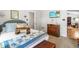 Bedroom featuring a TV, wooden chest and a bed with decorative throw pillows at 608 20Th St, Butner, NC 27509