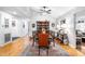 Spacious dining room featuring hardwood floors, elegant lighting, and ample seating at 608 20Th St, Butner, NC 27509