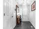 Bright entryway featuring slate floors, white walls, and decorative shelving and mirror at 608 20Th St, Butner, NC 27509