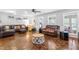 Comfortable living room featuring hardwood floors, ample seating, and abundant natural light at 608 20Th St, Butner, NC 27509