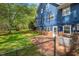 The backyard shows a lawn, generator and brickwork, along with a fenced area at 6321 Malvern Ln, Hillsborough, NC 27278