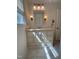 Bathroom featuring single sink vanity with marble countertop and decorative light fixtures at 6321 Malvern Ln, Hillsborough, NC 27278