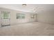 Large bonus room with natural light, ceiling fan and ample space for living or recreation at 6321 Malvern Ln, Hillsborough, NC 27278