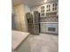Kitchen featuring stainless steel refrigerator and neutral countertops and cabinetry at 6321 Malvern Ln, Hillsborough, NC 27278