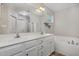 Bathroom featuring a double vanity, bathtub, and shower with glass door at 65 Cattail Ln, Zebulon, NC 27597