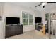 Spacious bedroom with two televisions, two dressers, and a bunk bed at 65 Cattail Ln, Zebulon, NC 27597