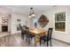 Inviting dining area with a wooden table, black chairs, and a decorative wall hanging at 65 Cattail Ln, Zebulon, NC 27597