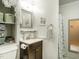 Bathroom featuring modern fixtures, a vanity with storage, and a shower with patterned curtain at 6760 Keansburg Rd, Gibsonville, NC 27249