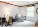 Cozy bedroom featuring a desk, chair, and a relaxing sitting area by the window at 6760 Keansburg Rd, Gibsonville, NC 27249