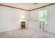 Spacious room with carpet and natural light, complemented by wood trim at 6760 Keansburg Rd, Gibsonville, NC 27249