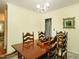 Cozy dining room featuring a large table with chairs, a vintage cabinet, and a modern chandelier at 6760 Keansburg Rd, Gibsonville, NC 27249