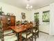 Traditional dining room with a wooden table, chairs, and a decorative chandelier for elegant meals and gatherings at 6760 Keansburg Rd, Gibsonville, NC 27249