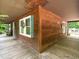 Charming home exterior featuring wood siding, a covered porch, and inviting decor at 6760 Keansburg Rd, Gibsonville, NC 27249