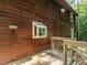 Side view of the charming home with a wooden deck and bay window at 6760 Keansburg Rd, Gibsonville, NC 27249
