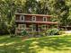 Charming two-story home with a welcoming porch and lush landscaping at 6760 Keansburg Rd, Gibsonville, NC 27249