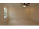 Bright bedroom with large window and neutral walls, ready for personalization and relaxation at 6973 Doddridge Ln # 17, Cary, NC 27519