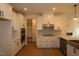 Bright new kitchen with white cabinets, stainless appliances, quartz countertops, and modern fixtures at 6973 Doddridge Ln # 17, Cary, NC 27519