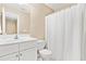 Bathroom features tiled floor, vanity sink, and a combination of shower and toilet at 7021 Oviedo Dr, Raleigh, NC 27603