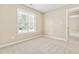 Bedroom boasts carpet floor and a large window with natural light at 7021 Oviedo Dr, Raleigh, NC 27603