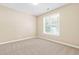 Bedroom boasts carpet floor and a large window with natural light at 7021 Oviedo Dr, Raleigh, NC 27603