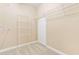 Walk-in closet with wall-mounted shelving and carpeted floors at 7021 Oviedo Dr, Raleigh, NC 27603