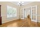 Bright dining room with hardwood floors, natural light, and open access to other living spaces at 7021 Oviedo Dr, Raleigh, NC 27603