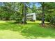 Secluded two-story home surrounded by lush greenery, offering privacy and a serene setting at 7021 Oviedo Dr, Raleigh, NC 27603